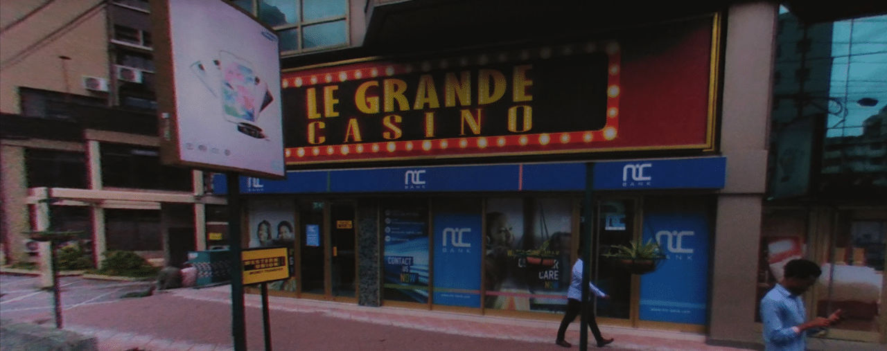This photo of the front entrance gate of Le Grande Casino in Dar es-Salaam, the largest city of the United Republic of Tanzania. Under the picture, on this page, you can read about the legal status of the various forms of Tanzania games of chance: internet lottery, digital bingo, electronic poker, sports betting, crypto wagering. There is also info about illegal gambling, betting on blood sports, the licensing system, taxation regime, and you can find a list of licensed online gambling websites, which accept Tanzanian players.