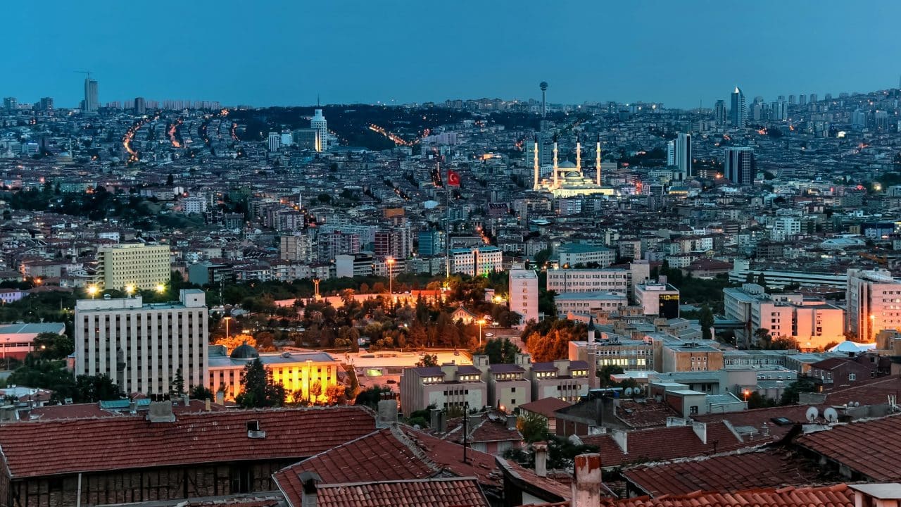 The picture is a cityscape of Ankara, capital of Turkey, during nighttime. The photo depicts a former casino building that was converted to an office after the 1998 casino ban, and Kocatepe mosque. Under the picture, on this page, you can read about the legal status of the various forms of Türkey games of chance: internet lottery, digital bingo, electronic poker, sports betting, crypto wagering. There is also info about the Turkish gambling licensing system, taxation regime, and you can find a list of online gambling websites, which accept players from the Republic of Turkey.