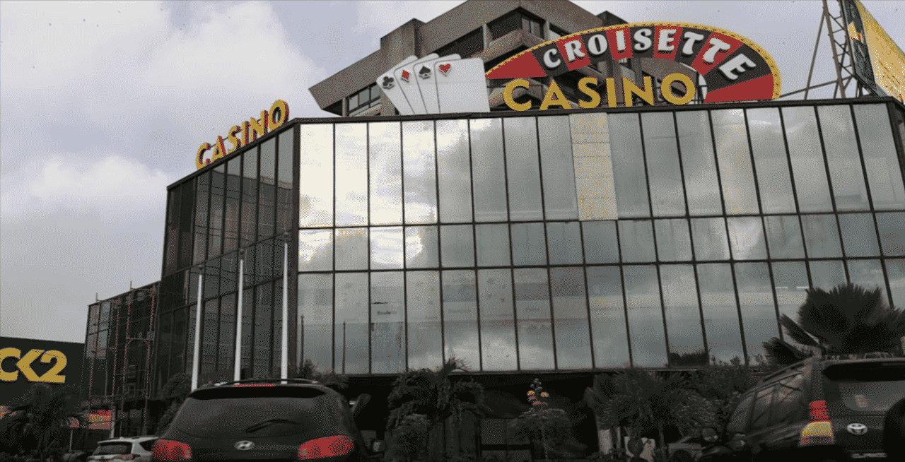 This a photo of the front entrance and facade of the building of Casino Croisette, in the capital of the Gabonese Republic, Libreville. Under the picture, on this page, you can read about the legal status of the various forms of Gabonese games of chance: internet lottery, digital bingo, electronic poker, sports betting, crypto wagering. There is also info about illegal gambling, betting on blood sports, the licensing system, taxation regime, and you can find a list of licensed online gambling websites, which accept Gabon players.