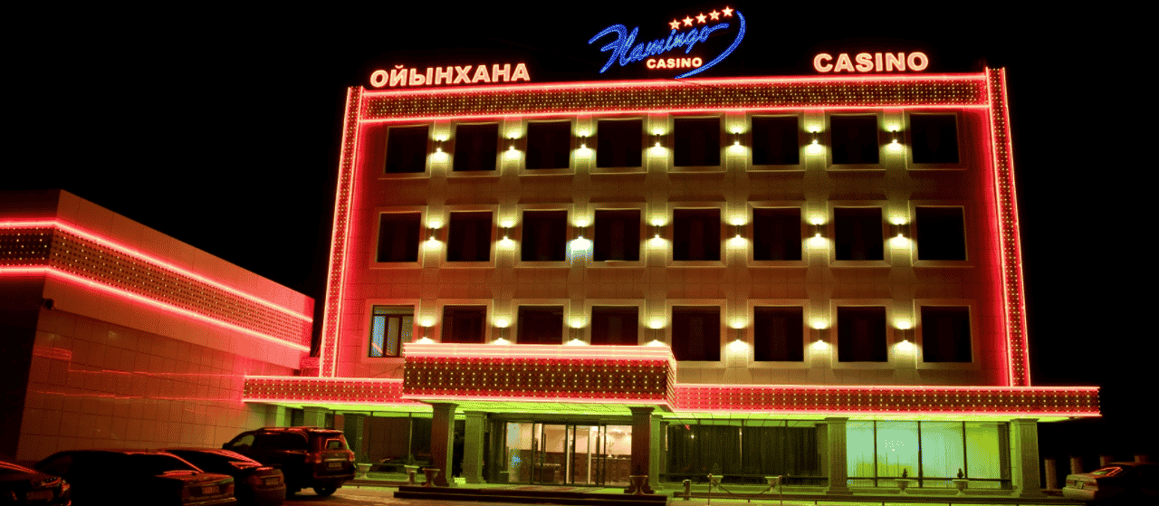 This a photo of Flamingo Casino in Kapchagay, the country's first gambling establishment after the introduction of the special gambling zone in 2008. The photo was taken at night, while the casino's neon lights were turned on. Under the picture, on this page, you can read about the legal status of the various forms of Kazakhstan games of chance: internet lottery, digital bingo, electronic poker, sports betting, crypto wagering. There is also info about betting on blood sports, the licensing system, and taxation of gambling winnings, and you can find a list of licensed online gambling websites, which accept Kazakhstani players.