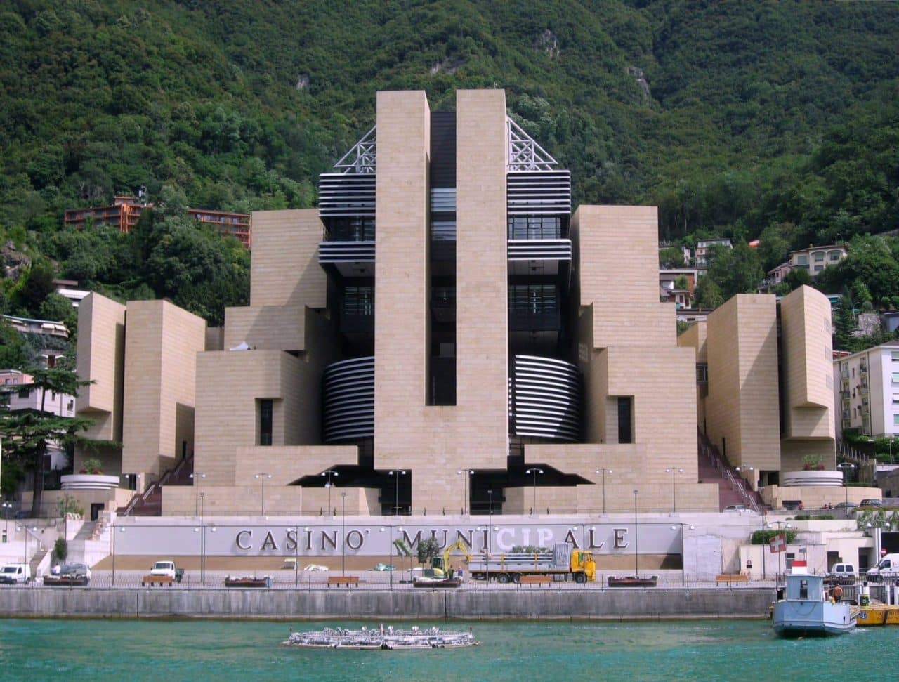 This is an image of Casino Municipale di Campione d'Italia (the biggest gambling establishment in Italy, reopened in 2021). On this page you can read about the legal status of the various forms of games of chance in Italy: sports betting, digital poker, online bingo, internet lottery, bitcoin wagering, electric keno in Italy. Additionally, you can find a list of Italy licensed online gambling websites on the page, which accept players from the country.