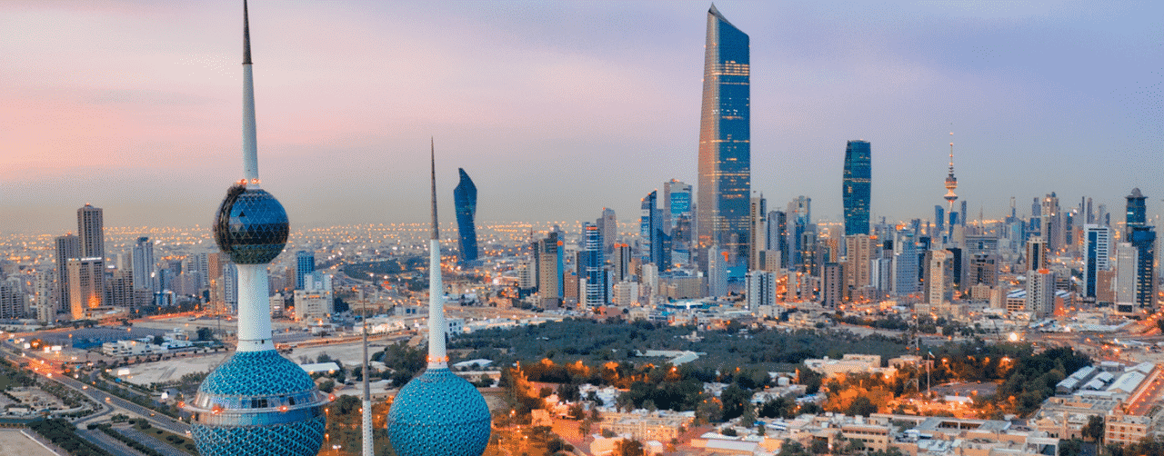 This photo of the skyline of Kuvait (a.k.a. Kuwait City), the capital of the State of Kuwait, with the some of the famous landmarks of the city visible. Under the picture, on this page, you can read about the legal status of the various forms of Kuwaiti games of chance: internet lottery, digital bingo, electronic poker, sports betting, crypto wagering. There is also info about illegal gambling, sharia law and betting on blood sports, the licensing system, taxation regime, and you can find a list of licensed online gambling websites, which accept Kuwaiti players.