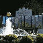 This is a picture of the front entrance gate, park and fountain of Casino Bad Ragaz,. You can read more information about this particular casino to the right of the picture, including address, opening hours, dress code, entrance fee, review analysis, number and types of games and a video.