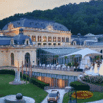 This is a picture of Baden-Baden Kurhaus and Spielbank, specifically, the main building, during the day. You can read more about this gambling establishment to the right of the picture.