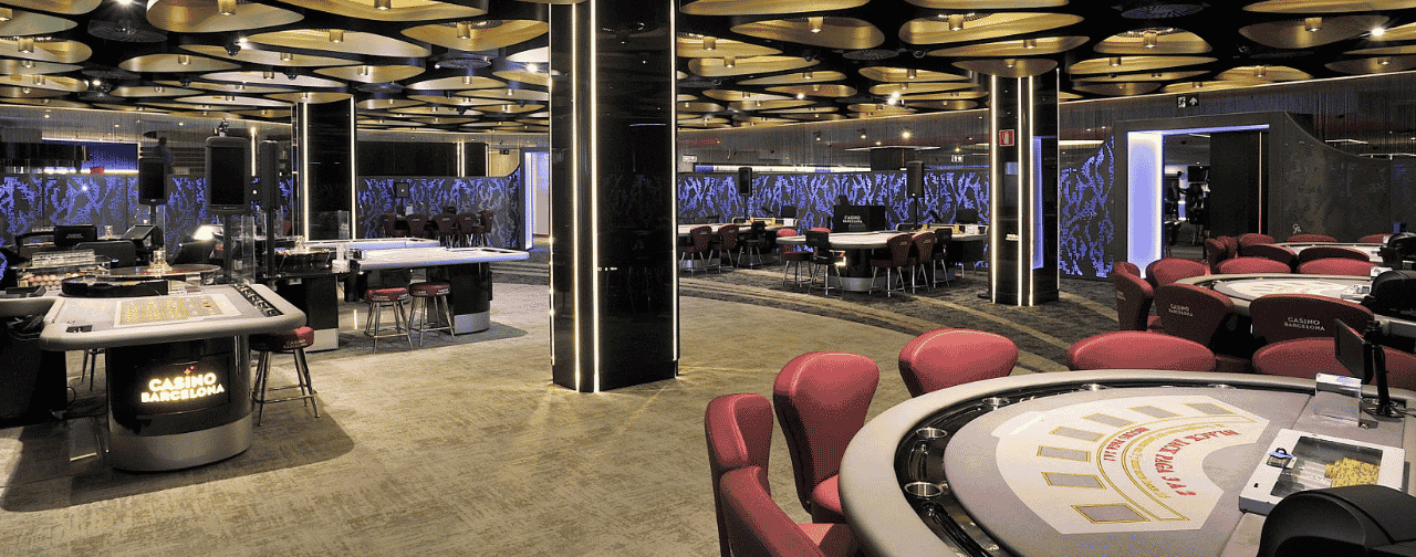 This is a photo of the interior of the gaming area of Casino Barcelona. You can find Casino Barcelona in the Spain casino list below, where you can read the details, address, opening hours, dress code, entrance fee, a meta analysis of the reviews of this venue. On this page, under the picture, you can find a list of all terrestrial Spanish casinos with review analysis and videos, and you can find a list of licensed online casino websites, which accept players from Spain.
