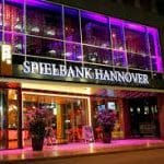This is a picture of Spielbank Hannover, specifically, the front gate at night, during the opening hours of the casino. You can read more about this gambling establishment and its restaurant and bar next to the picture.