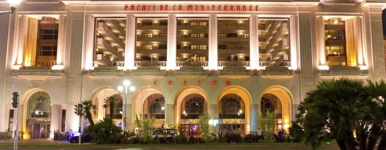 This is a picture of the front entrance of the French gaming venue Palais de la Méditerranée. Under this picture, on this page, you can find a list of all terrestrial France casinos, info about the legal status of gaming venues, slot halls, their taxation regime, licensing system, and you can find a list of Republic of France licensed online casinos, which accept players from the country.