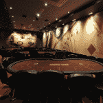 This is a picture of the interior and poker room of Casino & Poker Club de Marco Polo with a poker table visible. This is the last element on this list of Angolan casinos. You can find the other venues on this list above this one. You can read more about this gaming venue to the right of the picture: its' address, opening hours, dress code, entrance fee, and you can watch a video of the venue as well.