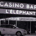 This is a picture of the front entrance and lit neon sign of Casino Barrière l'Éléphant d’Or d'Abidjan within the Sofitel Hotel complex. The picture was taken at night. This is the only casino in the Republic of Côte d'Ivoire right now. This is the first and last casino on this list of all Ivorian casinos. You can read more about this gaming venue to the right of the picture: its' address, opening hours, dress code, entrance fee, and you can watch a video of the venue as well.