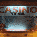 This is a picture of the sign of Casino de Port Gentil. This is the second and last casino on this list of all Gabonese casinos. You can read more about this gaming venue to the right of the picture: its' address, opening hours, dress code, entrance fee, and you can watch a video of the venue as well.