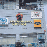 This is a picture of the logo of Golden Dragon Casino on the side of the Osu Mall (a.k.a. the Oxford Street Shopping Mall), in the capital of the Republic of Ghana, Accra. This is the third casino on this list of the top 5 biggest and best rated Ghanaian casinos. You can find the other gambling venues on this list above and below this one. You can read more about this gaming venue to the right of the picture: its' address, opening hours, dress code, entrance fee, and you can watch a video of the venue as well.