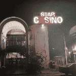 This is a picture of the front entrance, facade and neon sign of Star Casino in Bajul, the capital of the Republic of Gambia. This is the biggest casino in Gambia right now. This is the first casino on this list of all Gambian casinos. You can read more about this gaming venue to the right of the picture: its' address, opening hours, dress code, entrance fee, and you can watch a video of the venue as well. You can find the other Gambia casinos on this list below this one.