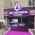 This is a photo of the front gate of Jacaranda Casino in Abuja, the capital of Nigeria. You can read more about this casino gambling establishment to the right of the picture: its' address, opening hours, dress code, entrance fee, and you can watch a video of the venue as well.