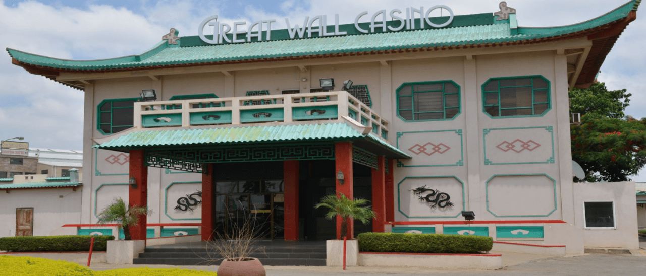 This is a photo of the front entrance gate of Great Wall Casino in Lusaka, the capital of the Republic of Zambia. Under this picture, on this page, you can find a list of all terrestrial Zambian casinos, info about the legal status of gaming venues, slot halls, their taxation regime, licensing system, and you can find a list of Zambia licensed online casinos, which accept players from the country.