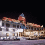 This is a picture of the lit front gate of Altai Palace Casino at night. This is the last element of this list of all Russian land-based casinos and their websites. You can find the other venues on this list above this one. Next to the picture you can read about the address, opening hours, number and types of games, reviews, entrance fee, dress code, and you can even watch a video of the place.