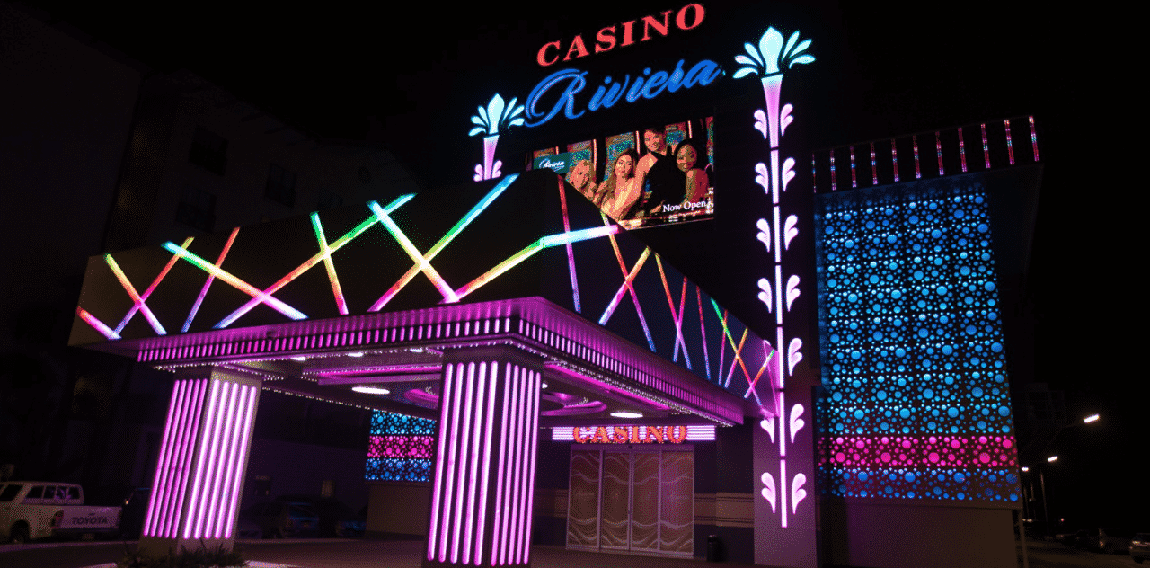 This is a picture of the front gate and neon sign of Casino Riviera in Paramaribo, the capital of the Republic of Suriname. On this page you can read about the taxation, legislation, licensing of casino gambling in Suriname, and you can find a list of licensed casino gambling establishments, slot halls and online casinos, which accept Surinamese players.