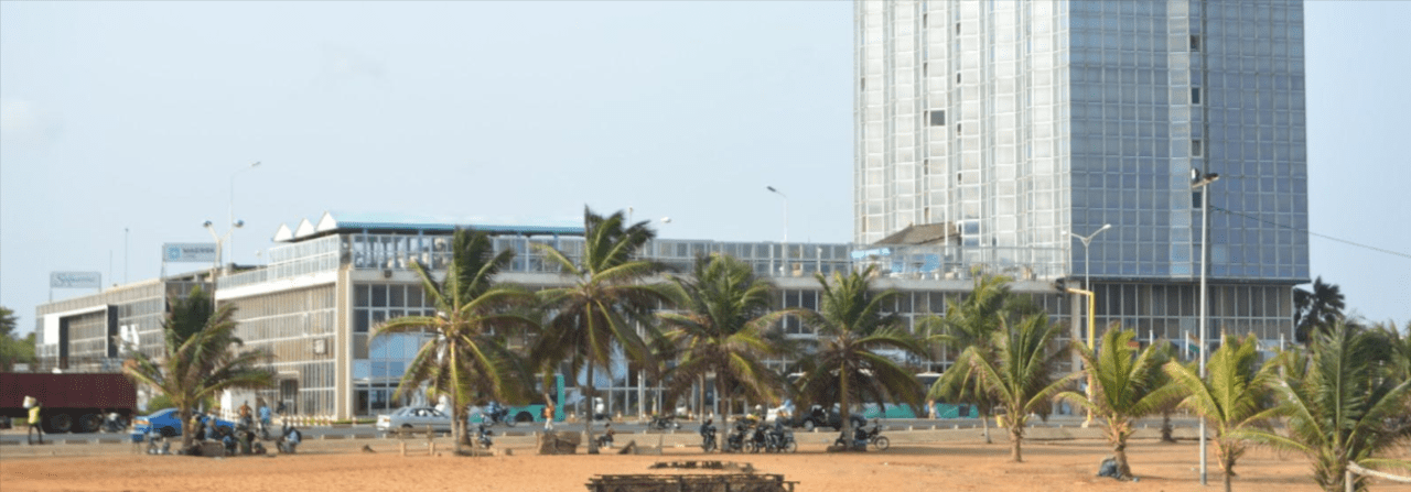 This is a photo of the tower of Hotel Palm Beach and Casino, which is located in Lomé, the capital of the Togolese Republic. Under this picture, on this page, you can find a list of all terrestrial Togo casinos, info about the legal status of gaming venues, slot halls, their taxation regime, licensing system, and you can find a list of Togo licensed online casinos, which accept players from the country.