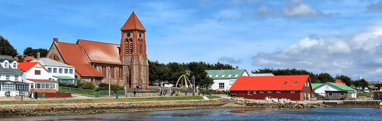 This is a picture of the skyline of Port Stanley, the capital and biggest city of the Falkland Islands. On this page you can read about the taxation, legislation, licensing of casino gambling in this British Overseas Territory, and you can find a list of licensed casino gambling establishments, slot halls and online casinos, which accept players from the Falkland Islands.